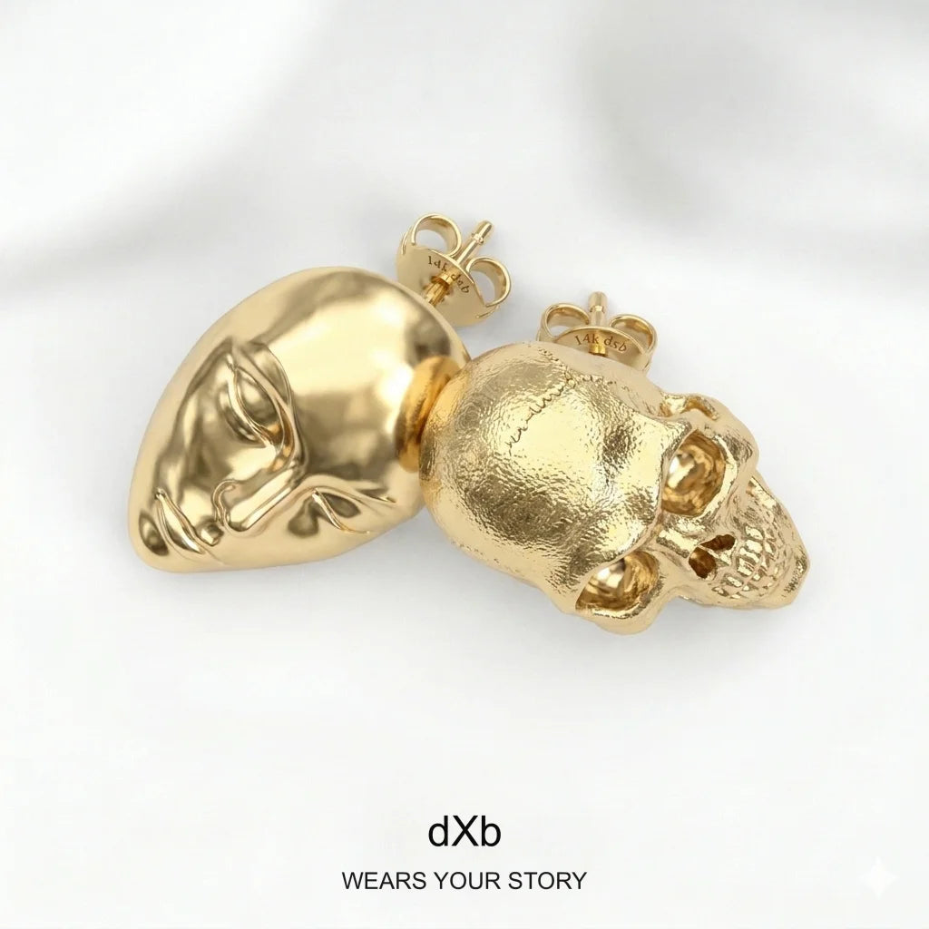 14k Gold Skull & Face Statement Stud Earrings in High Polished Yellow Gold, 45° overhead view