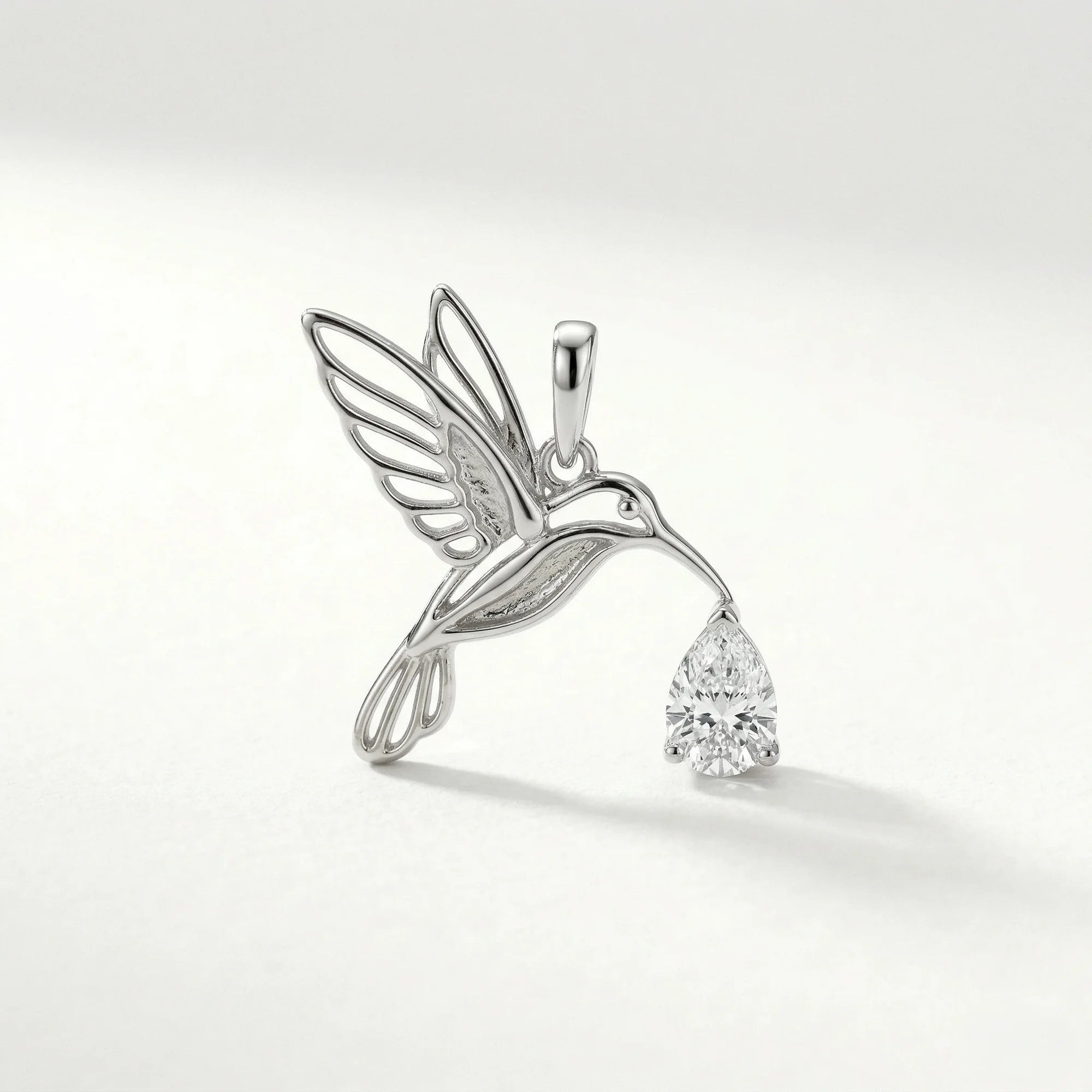 platinum colorless gemstone pear hummingbird motif, nature-inspired, outline pendant